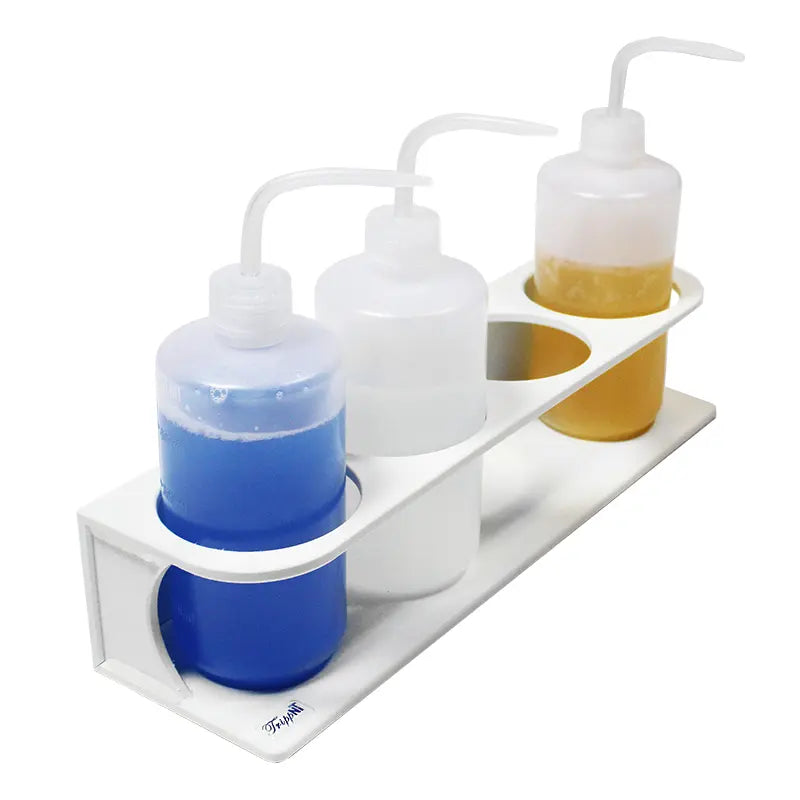 TrippNT 50539 — in-use view with 4 x 500mL bottles staged on fume hood side baffle showing chemical-resistant HDPE construction