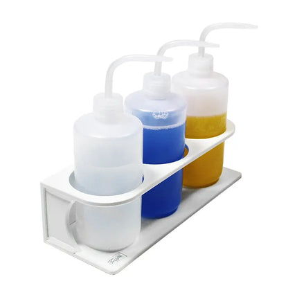 TrippNT 50571 — in-use view with 3 x 500mL solvent bottles on fume hood interior wall