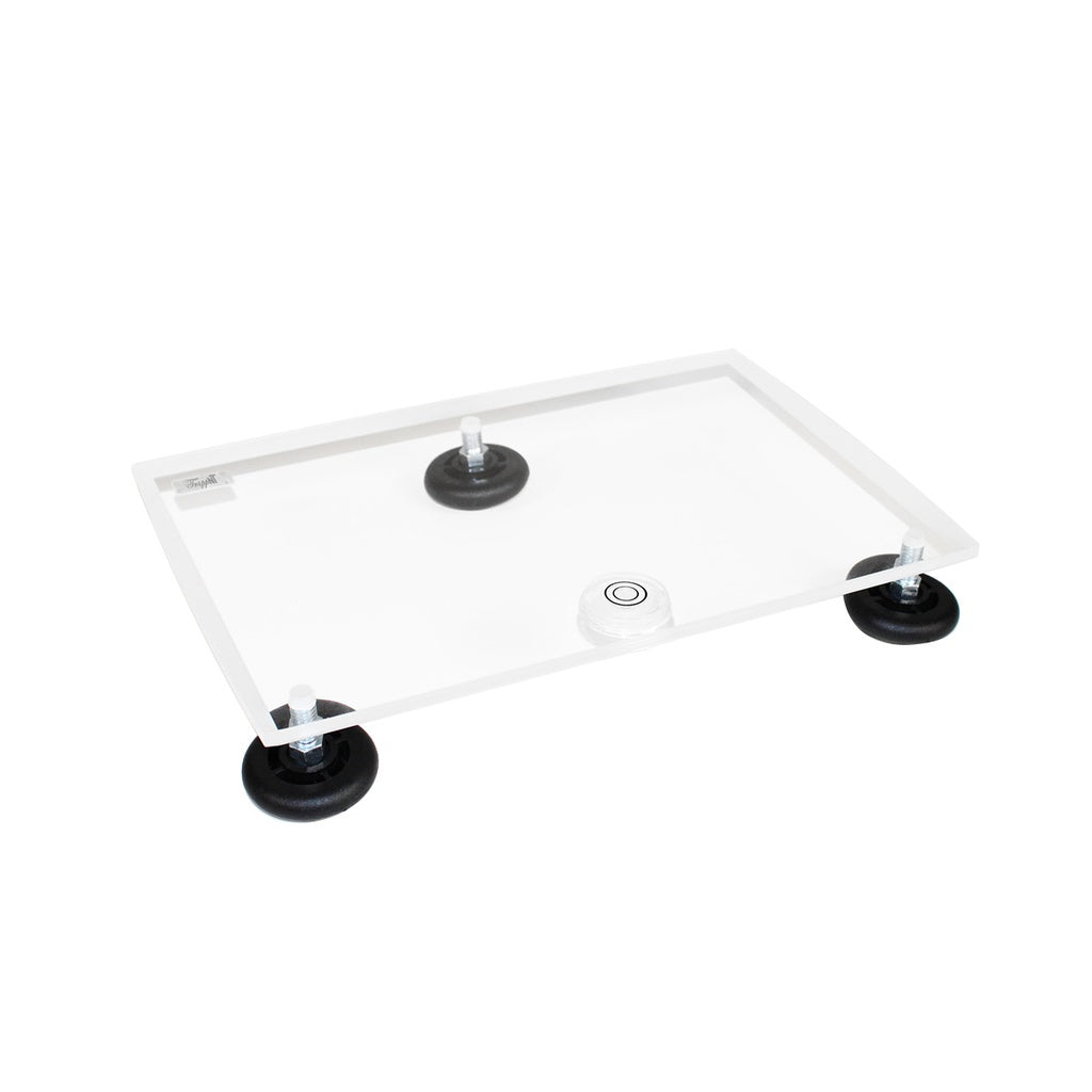 TrippNT 50600 — primary hero, clear 3/8-inch acrylic medium precision leveling table with built-in bubble level and 3 rubber tripod legs